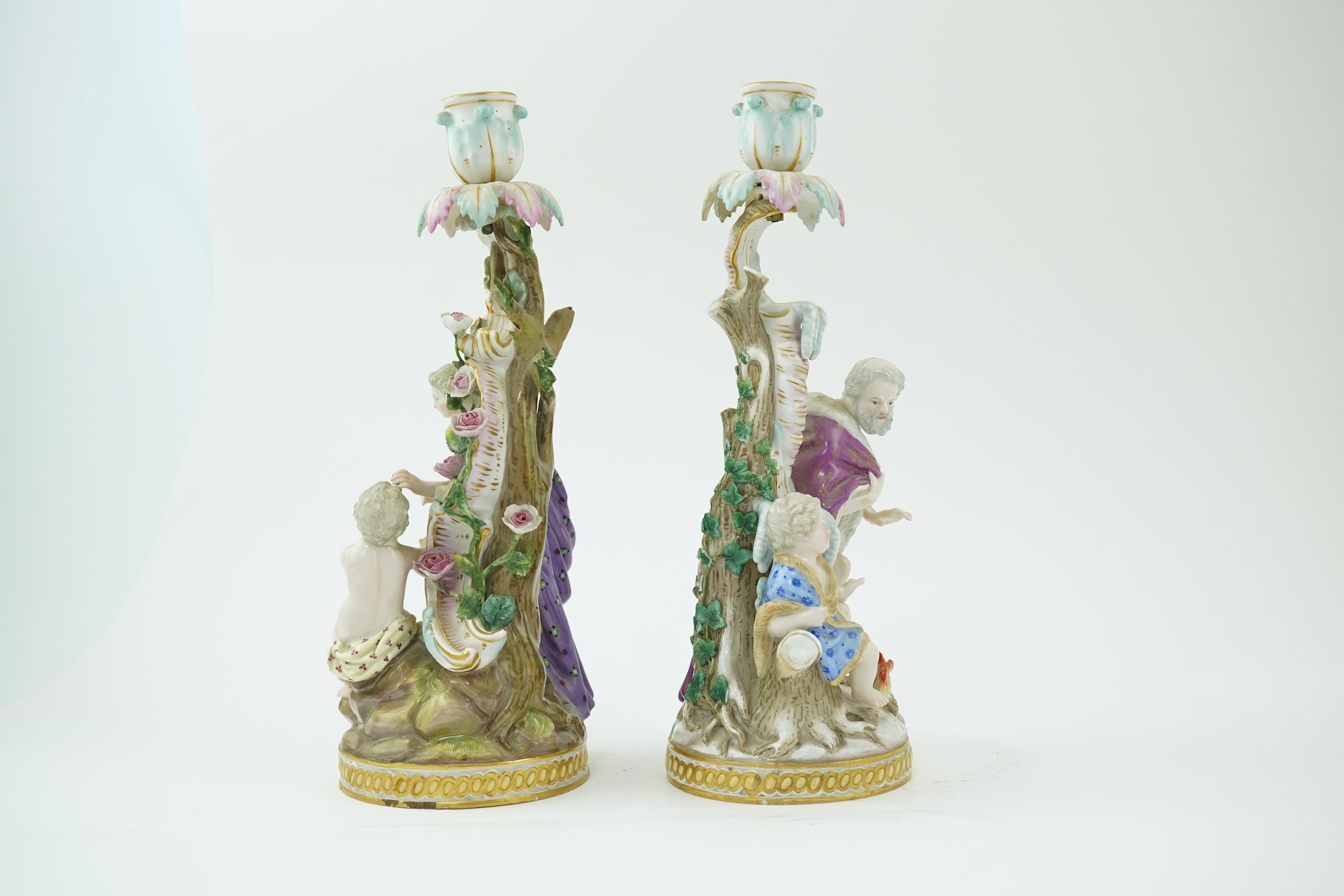 A near pair of Meissen figural candlesticks, late 19th century